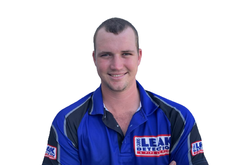 Photo of Darcy Flower, plumber who is wearing a royal blue and black polo shirt with a Cairns Leak Detection logo
